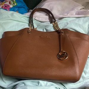 Michael kors purse brown almost new no tears very neat and clean